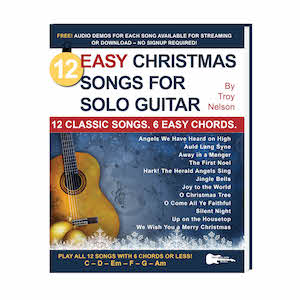 solo guitar book cover with christmas decorations