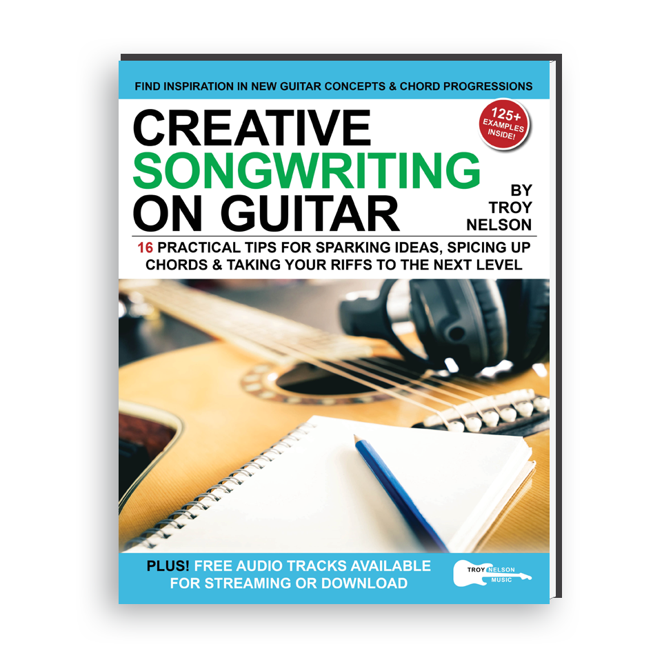 Image of a Guitar and notepad on a Book Cover
